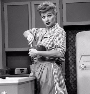 I Love Lucy wearing an apron