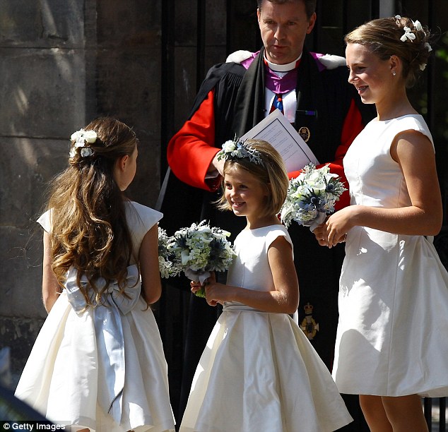 Adorable: The flower girls in their full-skirted frocks excitedly await for the beautiful bride to arrive