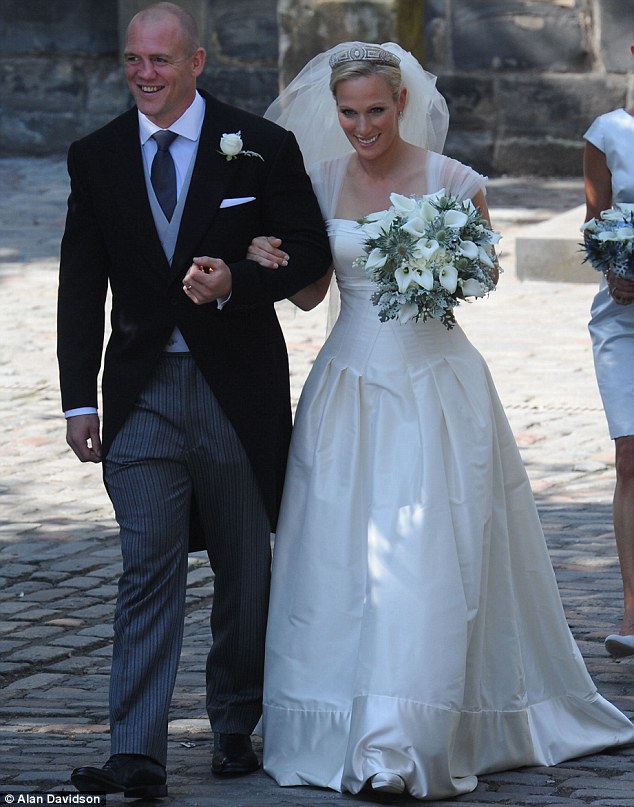 Newlyweds: Zara and Tindall make their way out of the church a married couple