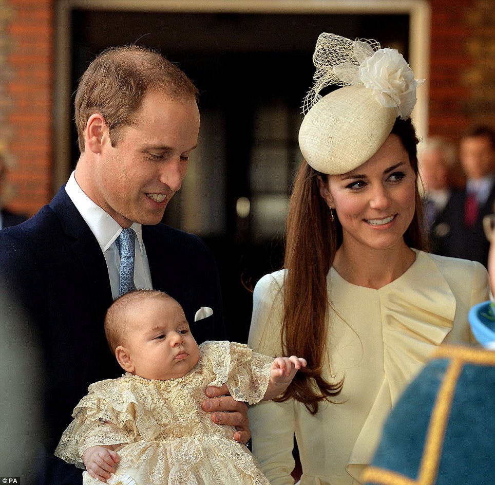 Smiling and happy: The Duke and Duchess of Cambridge grinned at their family as they held their young prince