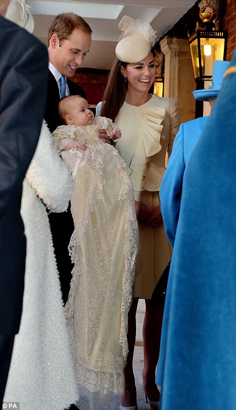 Queen Elizabeth II speaks with the Duke and Duchess of Cambridge