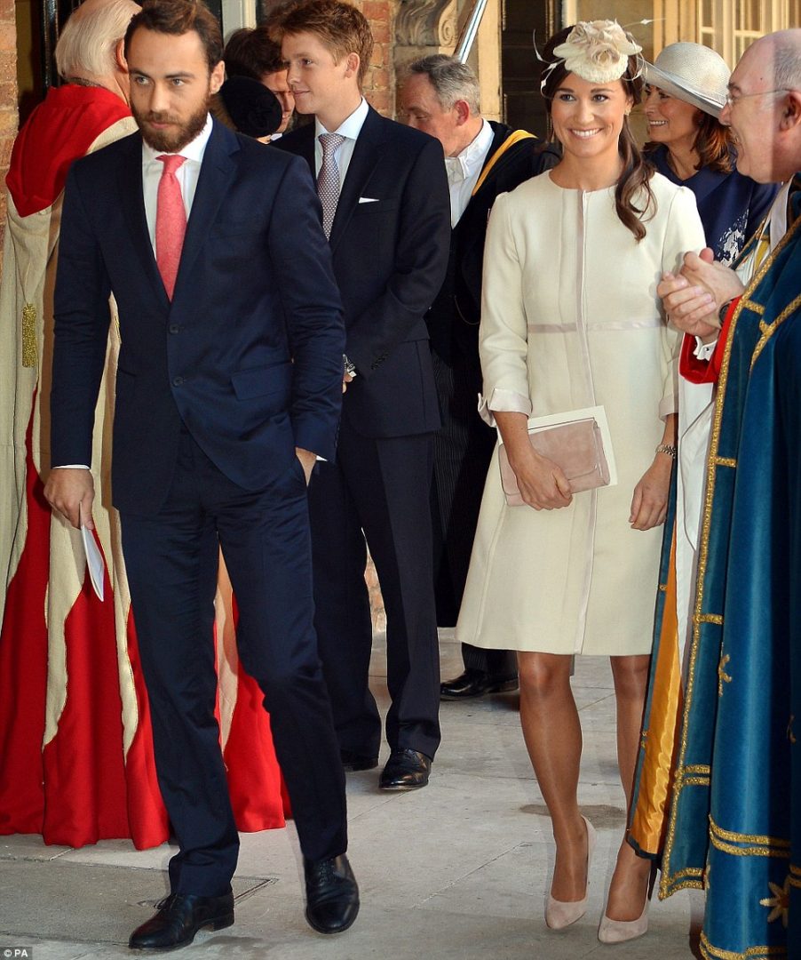 Siblings: Pippa and James Middleton walk out of the chapel with the small congregation, including their smiling mother Carole this afternoon