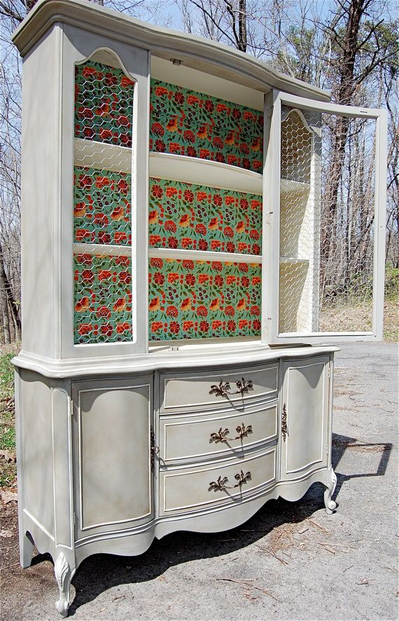 French provincial hand painted china cabinet hutch with chicken wire and a decorative decoupaged interior