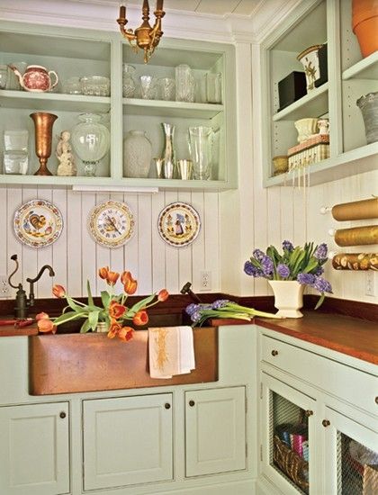 copper sink, bead board backsplash, open shelving, wood counters, green painted cabinets