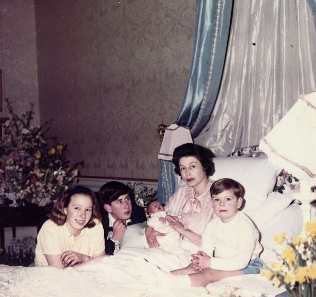 The Queen in bed after the birth of Prince Edward in 1964 surrounded by her other children, Prince Charles of Wales, 15, Prince Andrew, 4, and Princess Anne, Princess Royal, 13.: 