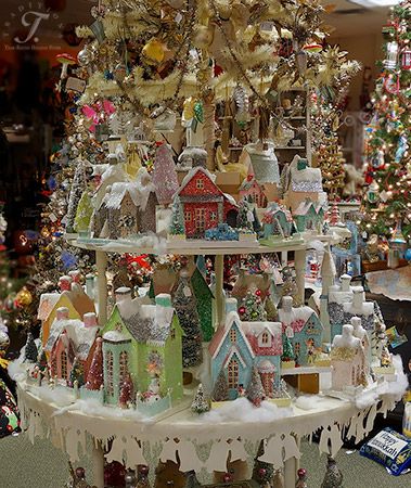 Cody Foster Folk Art, Putz Houses and his trees on a round 2 tier table we designed and constructed to showcase his vintage houses. There is an antique feather tree in the middle of it, coming out of the top tier full of vintage Christmas ornaments!: 