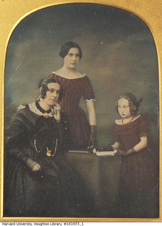 mother and daughters wearing gloves