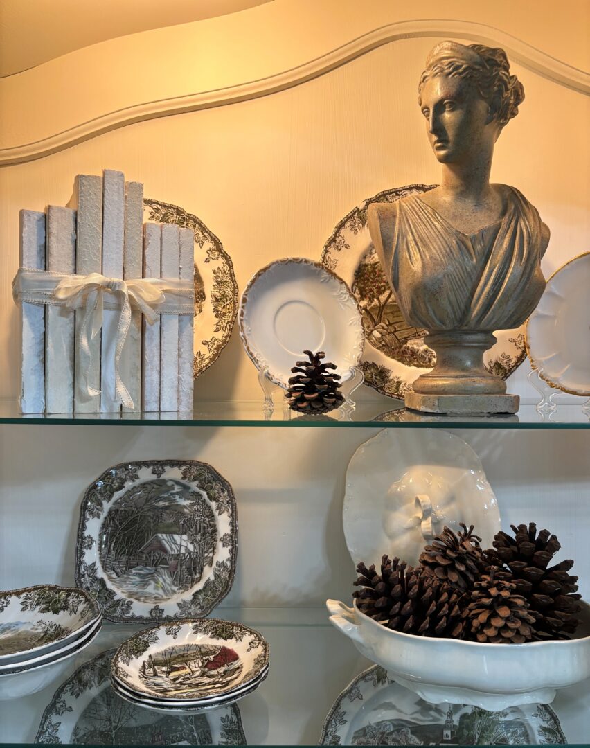 Bust scultpture and books